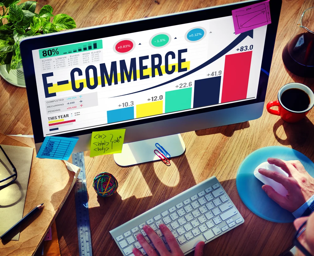 Desktop computer displaying an e-commerce website with online shopping and product browsing elements.