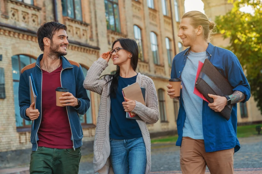 International students walking together on a university campus.